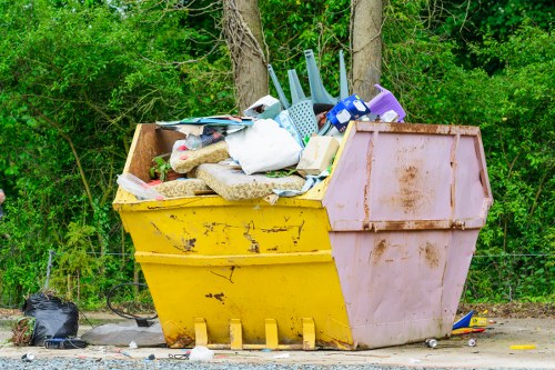 Waste collection team handling rubbish removal in a London street