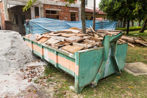 Garage clearance work in a London property with cluttered storage items