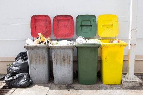 Waste removal team handling mixed builders waste in London