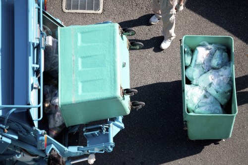 Service team assessing a waste removal complaint with supporting notes