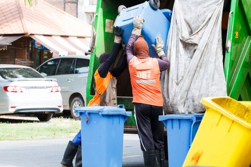 Sorted items and removal bags during a London hoarder clearance job