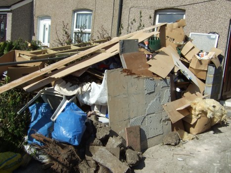 Bulky furniture and mixed rubbish prepared for removal in London